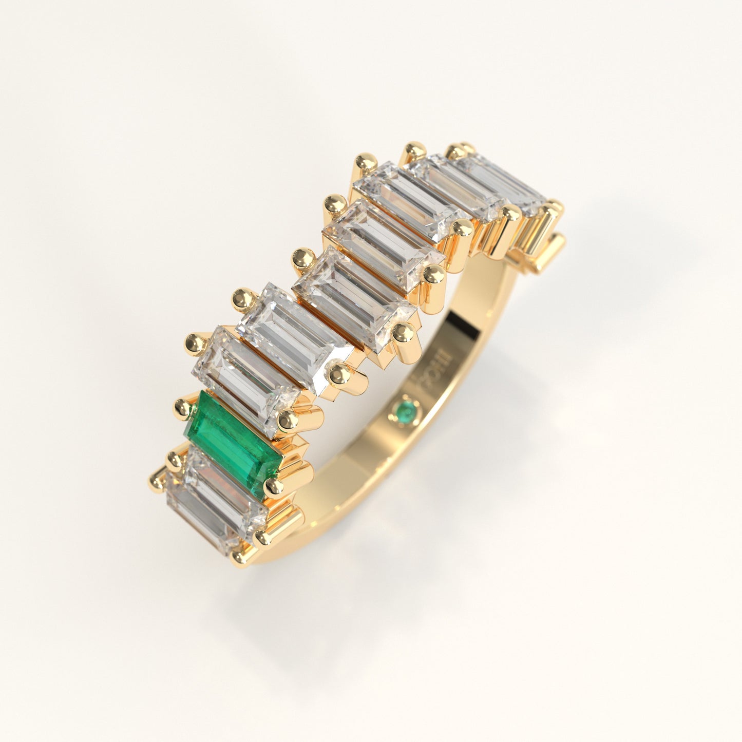 Cadence Ring in 18k yellow gold — Colombian emerald and baguette diamond band, 1Em Collection by GOHI stand