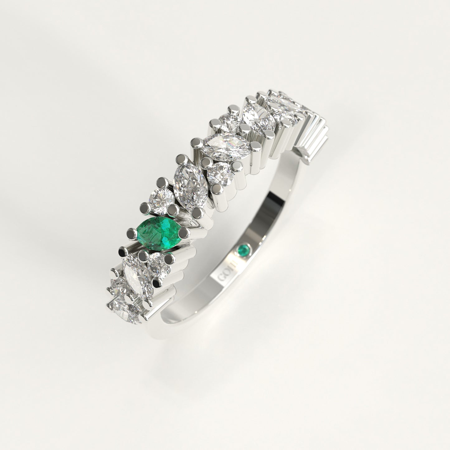 Flourish Ring in 18k white gold — Colombian emerald and marquise diamond band, 1Em Collection by GOHI stand