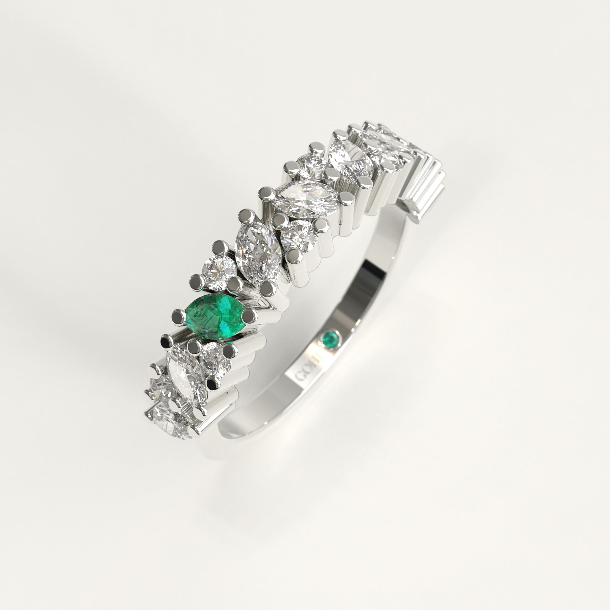 Flourish Ring in 18k white gold — Colombian emerald and marquise diamond band, 1Em Collection by GOHI stand