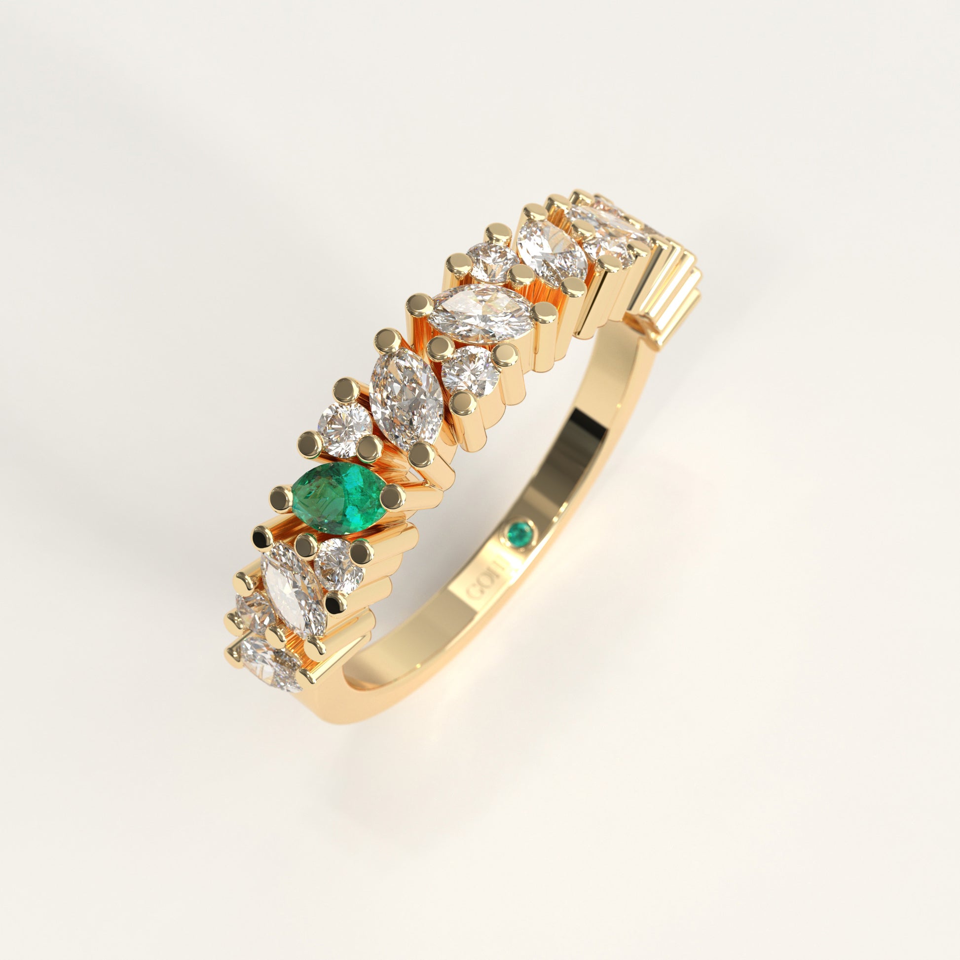 Flourish Ring in 18k yellow gold — Colombian emerald and marquise diamond band, 1Em Collection by GOHI stand