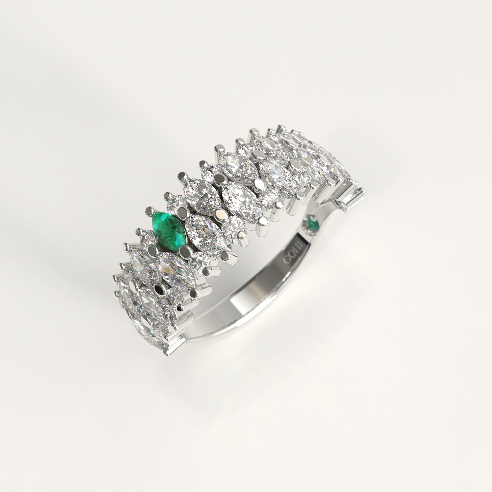 Garland Ring in 18k white gold — Colombian emerald and double row marquise diamond band, 1Em Collection by GOHI stand