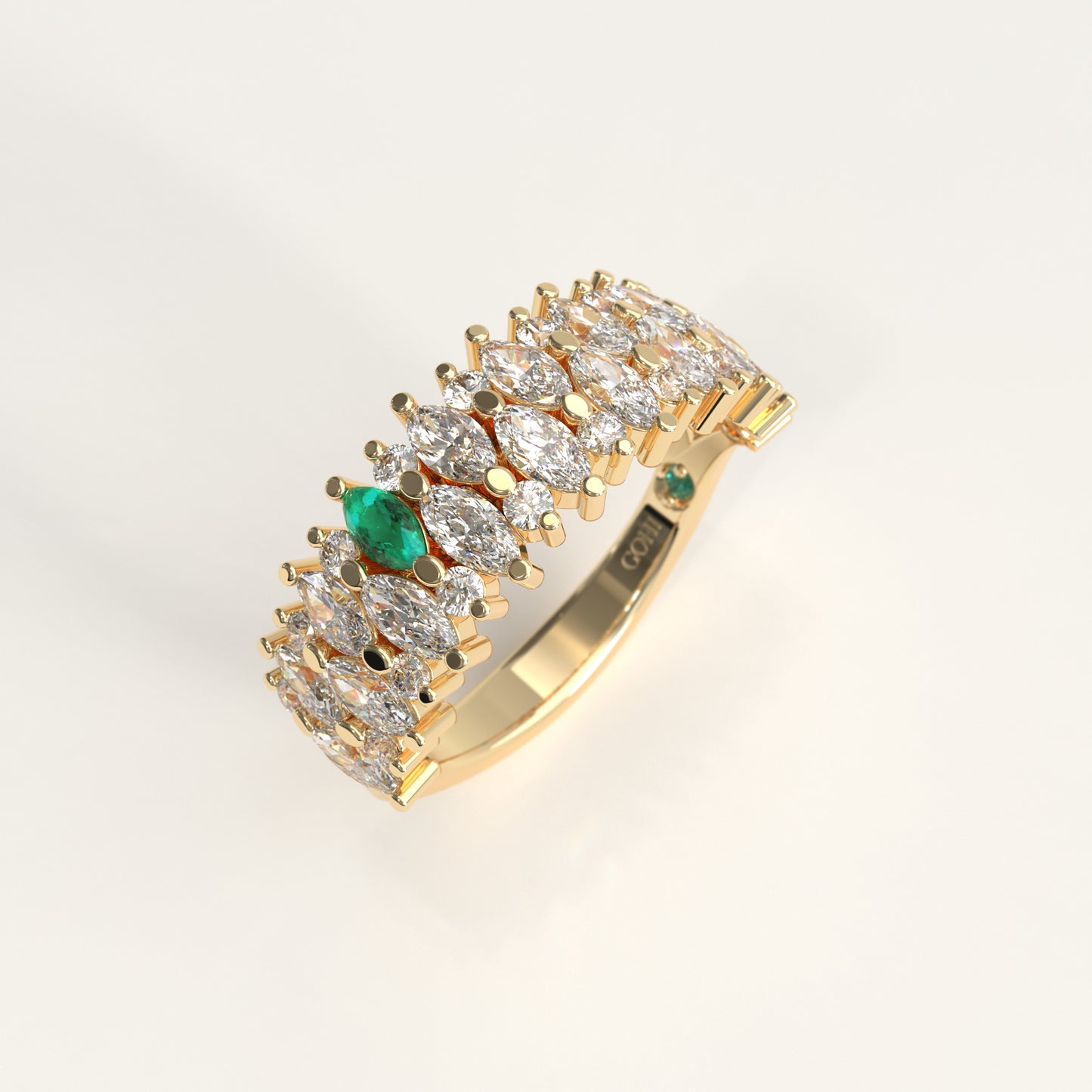 Garland Ring in 18k yellow gold — Colombian emerald and double row marquise diamond band, 1Em Collection by GOHI stand