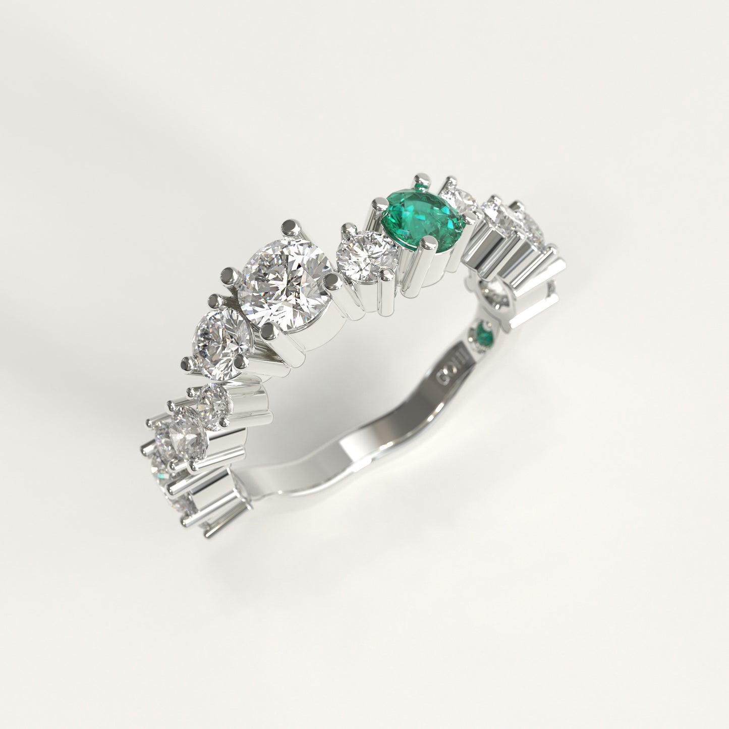 Meridian Ring in 18k white gold — Colombian emerald and graduated round diamond band, 1Em Collection by GOHI stand