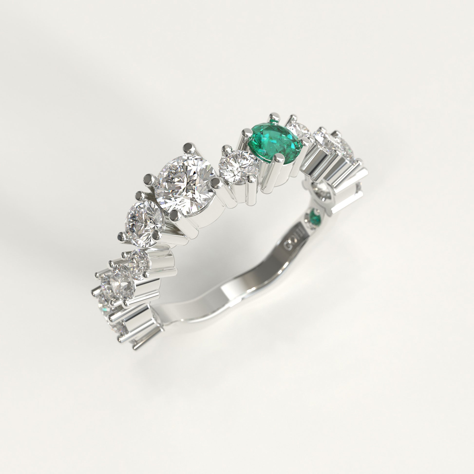 Meridian Ring in 18k white gold — Colombian emerald and graduated round diamond band, 1Em Collection by GOHI stand