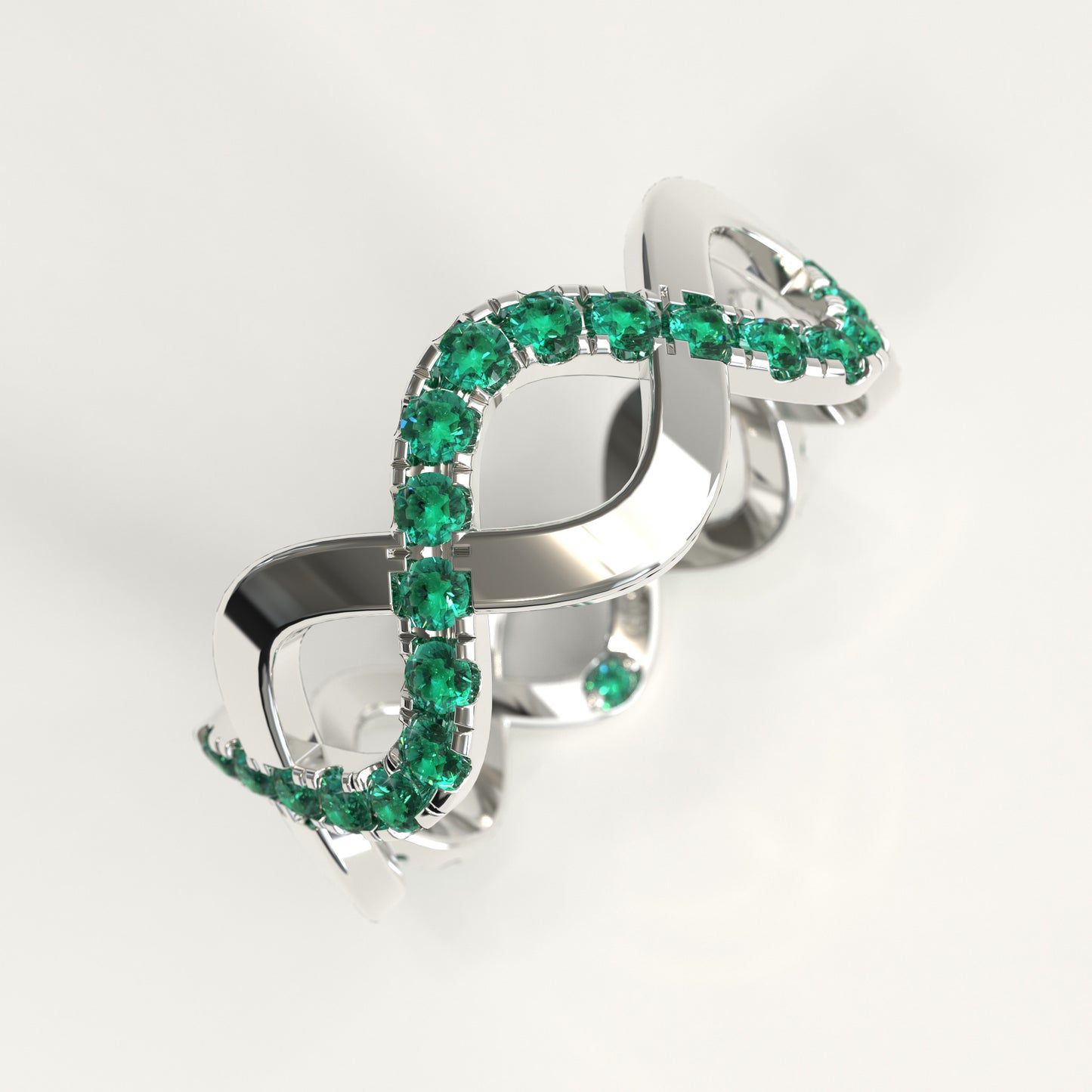 Close-up of interlocking bands with round Colombian emeralds, Weave Ring by GOHI Endless Collection