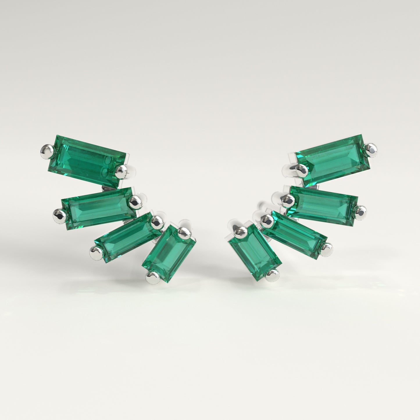 Flare Earrings in 18k white gold — Colombian emerald baguettes fanning open as ear climbers, Fault Line Collection by GOHI