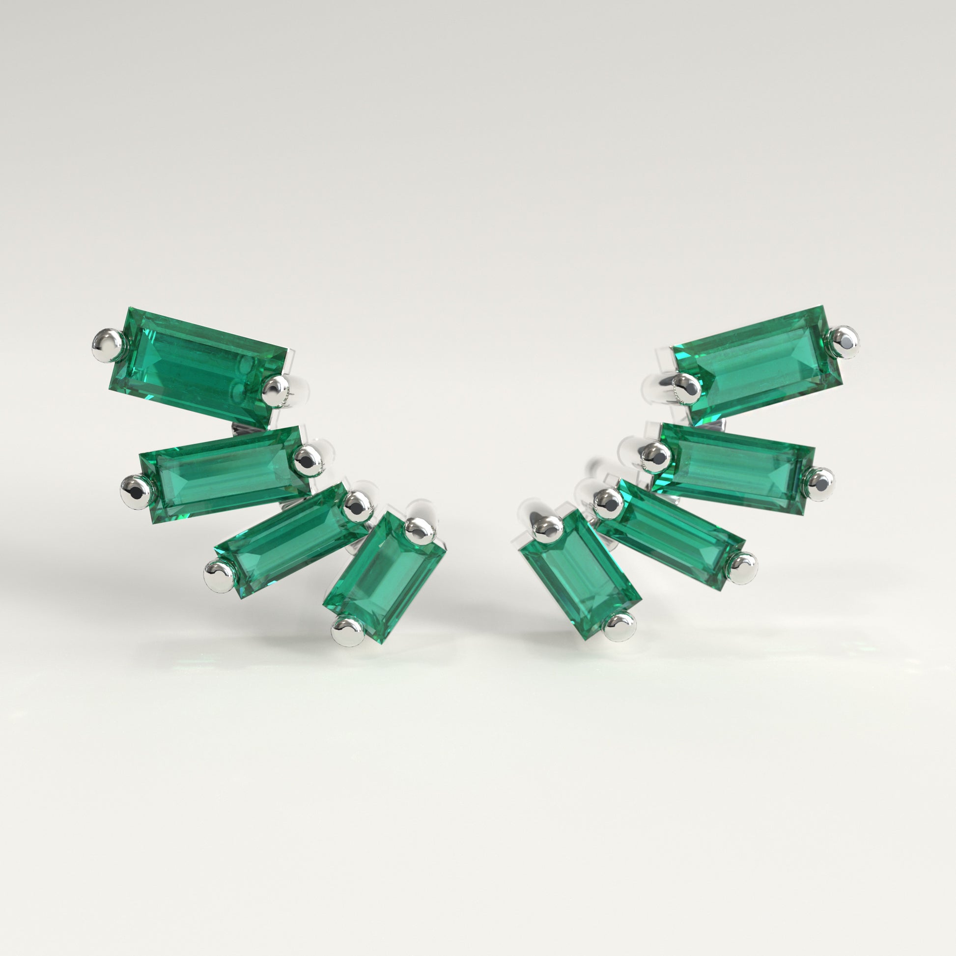 Flare Earrings in 18k white gold — Colombian emerald baguettes fanning open as ear climbers, Fault Line Collection by GOHI