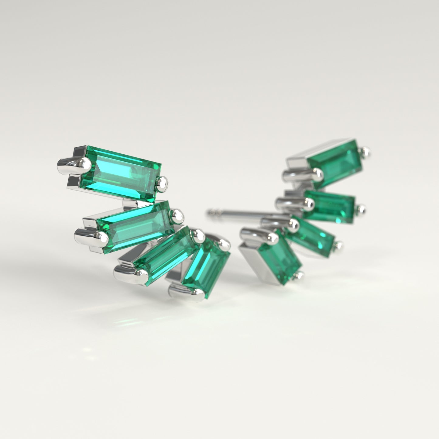 Flare Earrings in 18k white gold — Colombian emerald baguettes fanning open as ear climbers, Fault Line Collection by GOHI lat