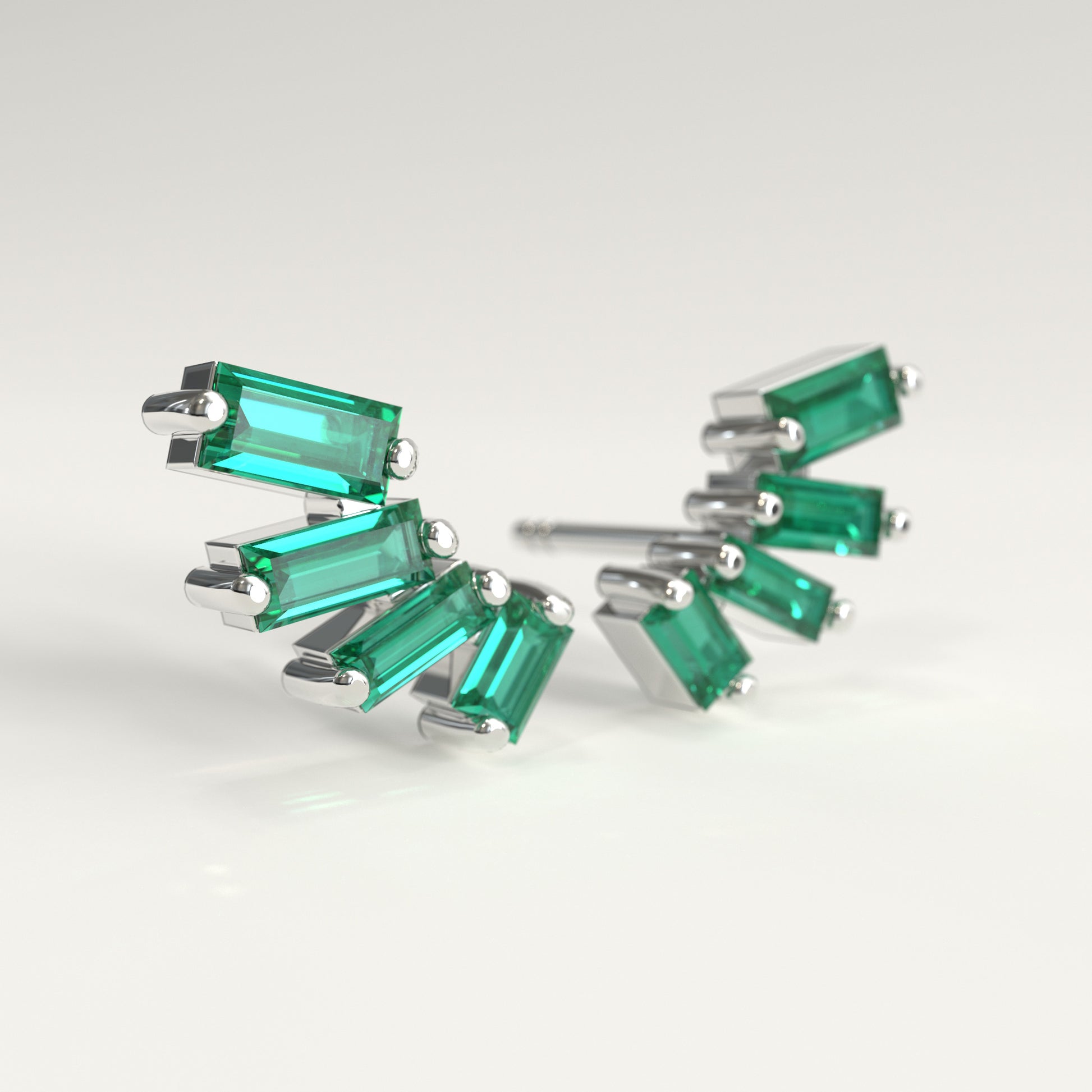 Flare Earrings in 18k white gold — Colombian emerald baguettes fanning open as ear climbers, Fault Line Collection by GOHI lat