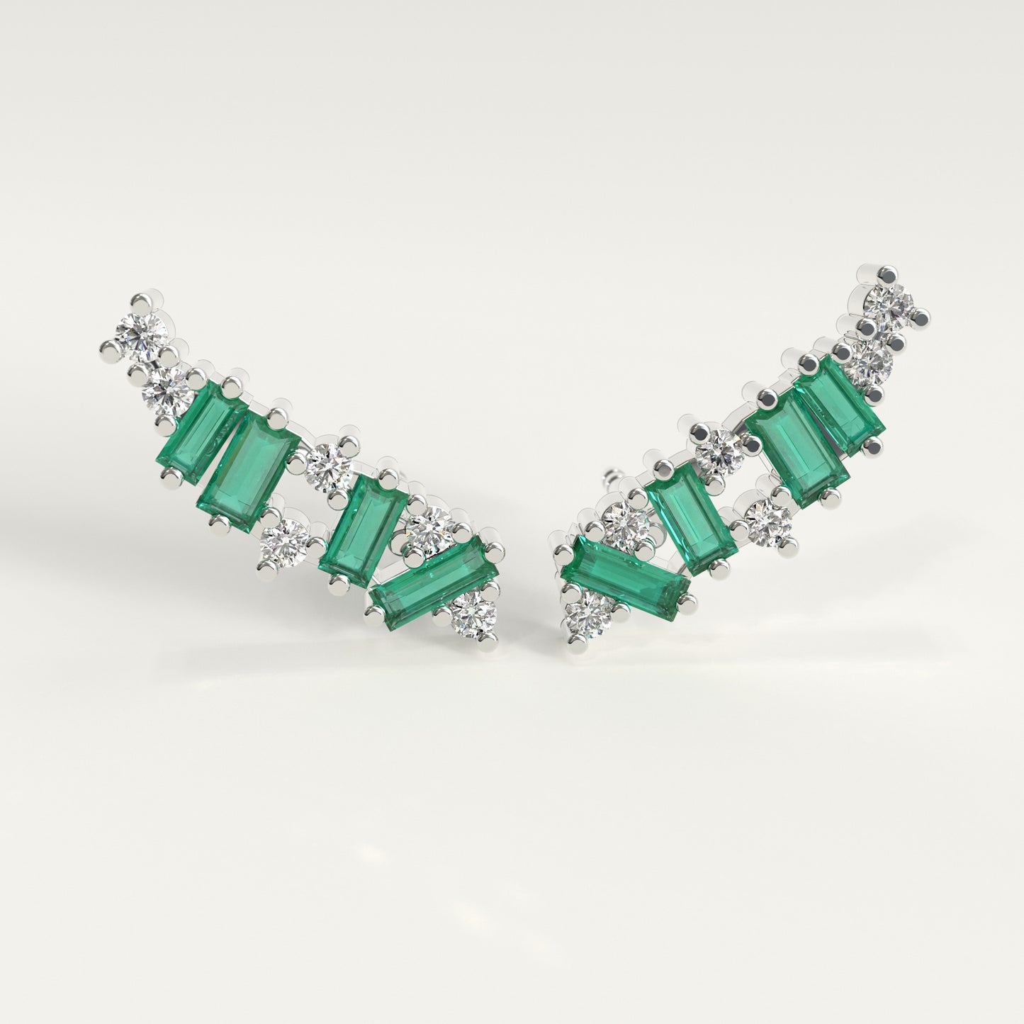 Front view of Rise Earrings — Colombian emerald dominant ear climbers with round diamonds in 18k white gold, GOHI Fault Line