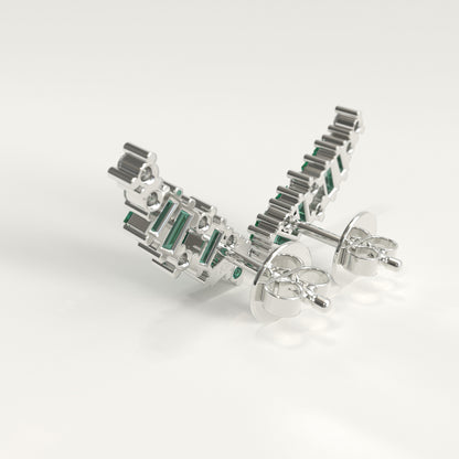 Back view of Rise Earrings showing hidden Colombian emerald beside GOHI signature, 18k white gold ear climbers