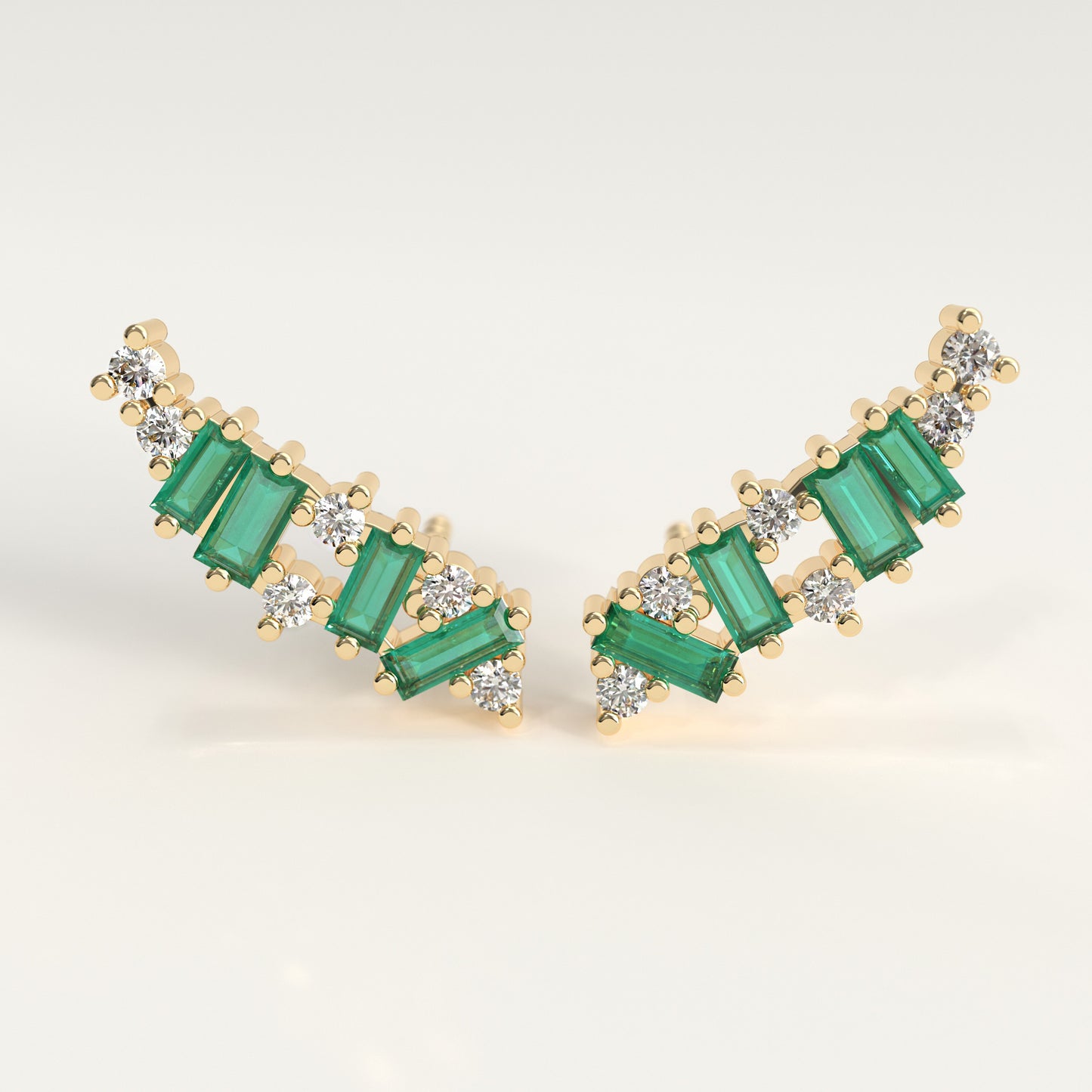 Rise Earrings in 18k yellow gold — Colombian emerald baguettes and round diamonds climbing the ear, Fault Line Collection by GOHI