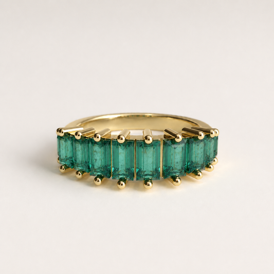 Seam Ring in 18k yellow gold — ten Colombian emerald baguettes in a continuous band, Fault Line Collection by GOHI
