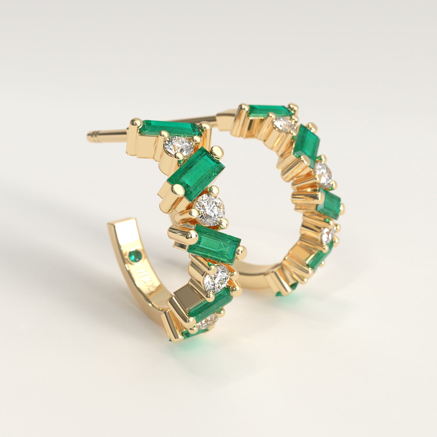 Shift Earrings in 18k yellow gold — Colombian emerald baguettes and round diamonds in alternating hoop earrings, Fault Line Collection by GOHI lateral